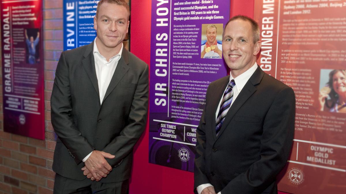 Sir Chris Hoy with Jim Aitken MBE in front of his Hall of Fame board