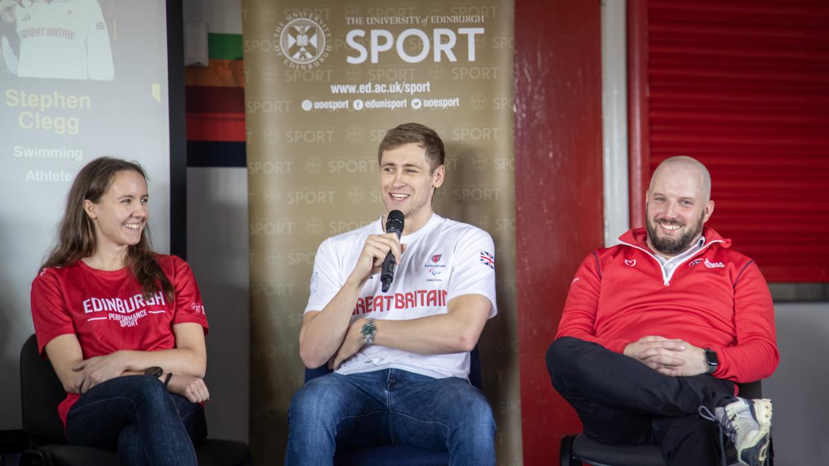 Image of stephen clegg holding microphone smiling next to fiona bunn and mat trodden