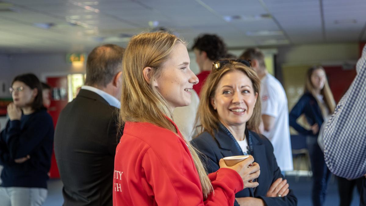 Image of Aleksandra Kalucka speaking to Catherine Martin