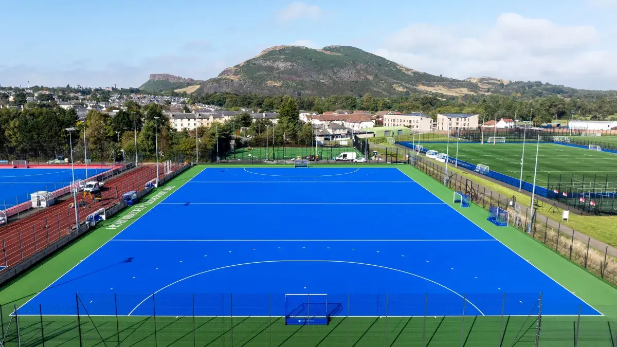 Image from the sky of the new Hockey pitch at Peffermill. Arthurs seat can be seen in the background