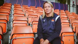 Claire Cruikshank sitting in stadium stand