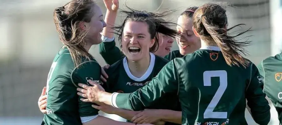 Women's sports team hugging