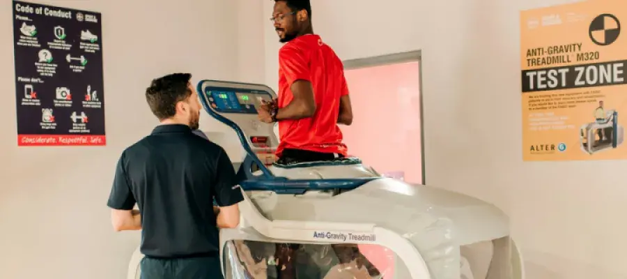 Man runs on anti-gravity treadmill whilst talking to specialist