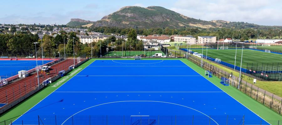 Image from the sky of the new Hockey pitch at Peffermill. Arthurs seat can be seen in the background