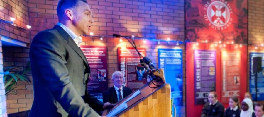 Sir Chris Hoy giving speech beside University Sport Hall of Fame