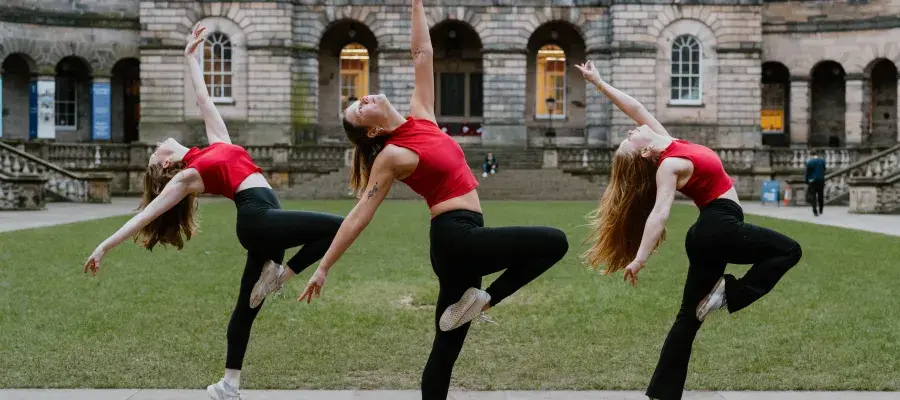 Image of 3 dancers in edinburgh old college quad dancing