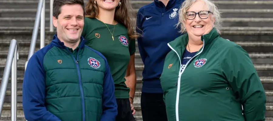 Four people in university of Edinburgh kit