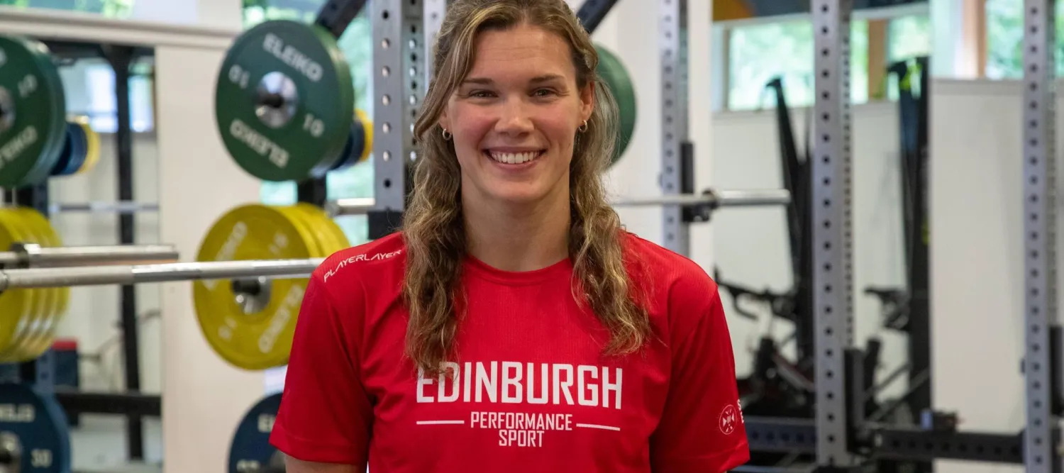 grace reid wearing red tshirt in performance gym