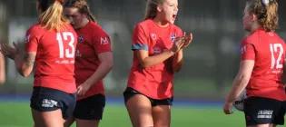 Players from women's sports team on pitch
