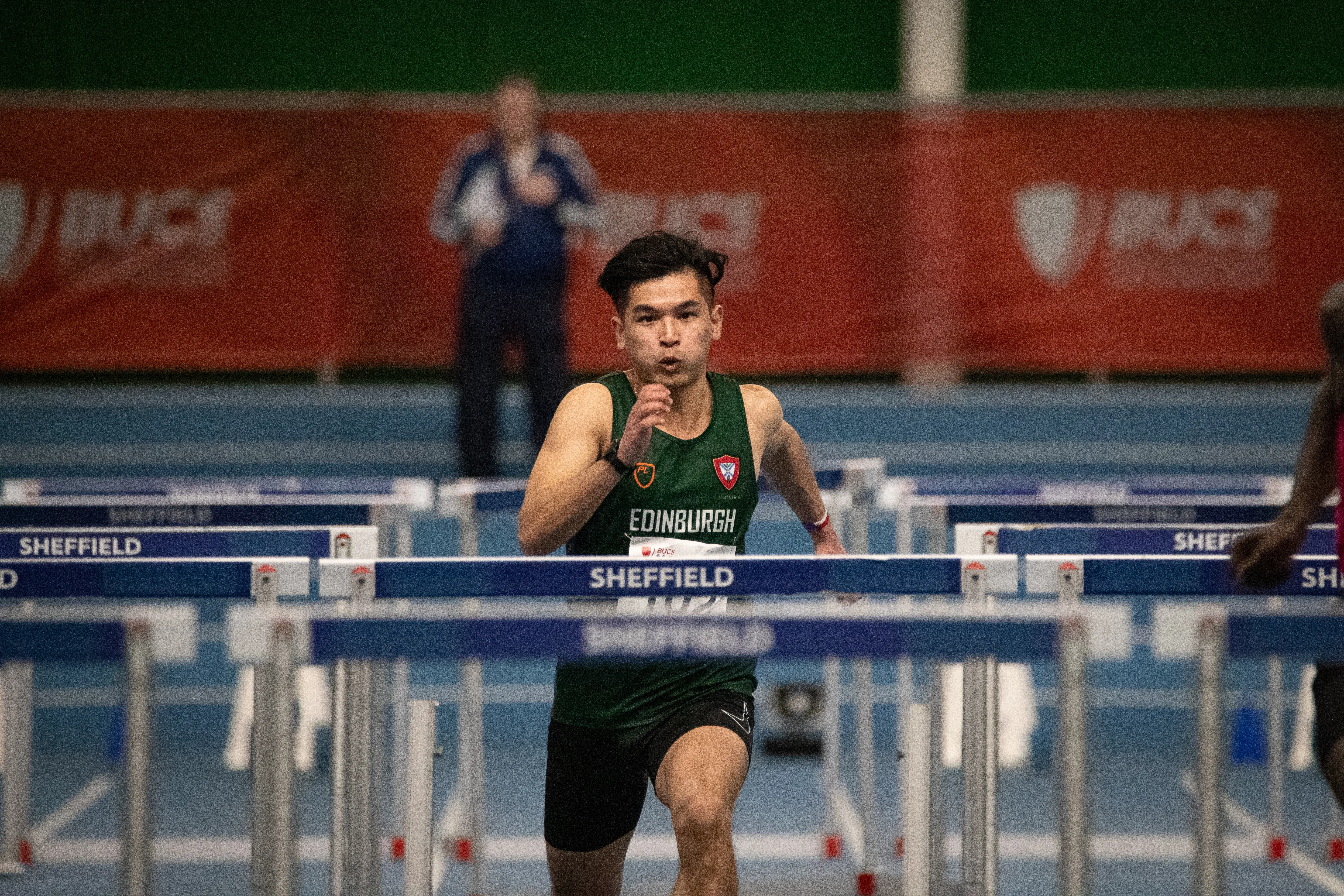 Image of athlete running hurdles race