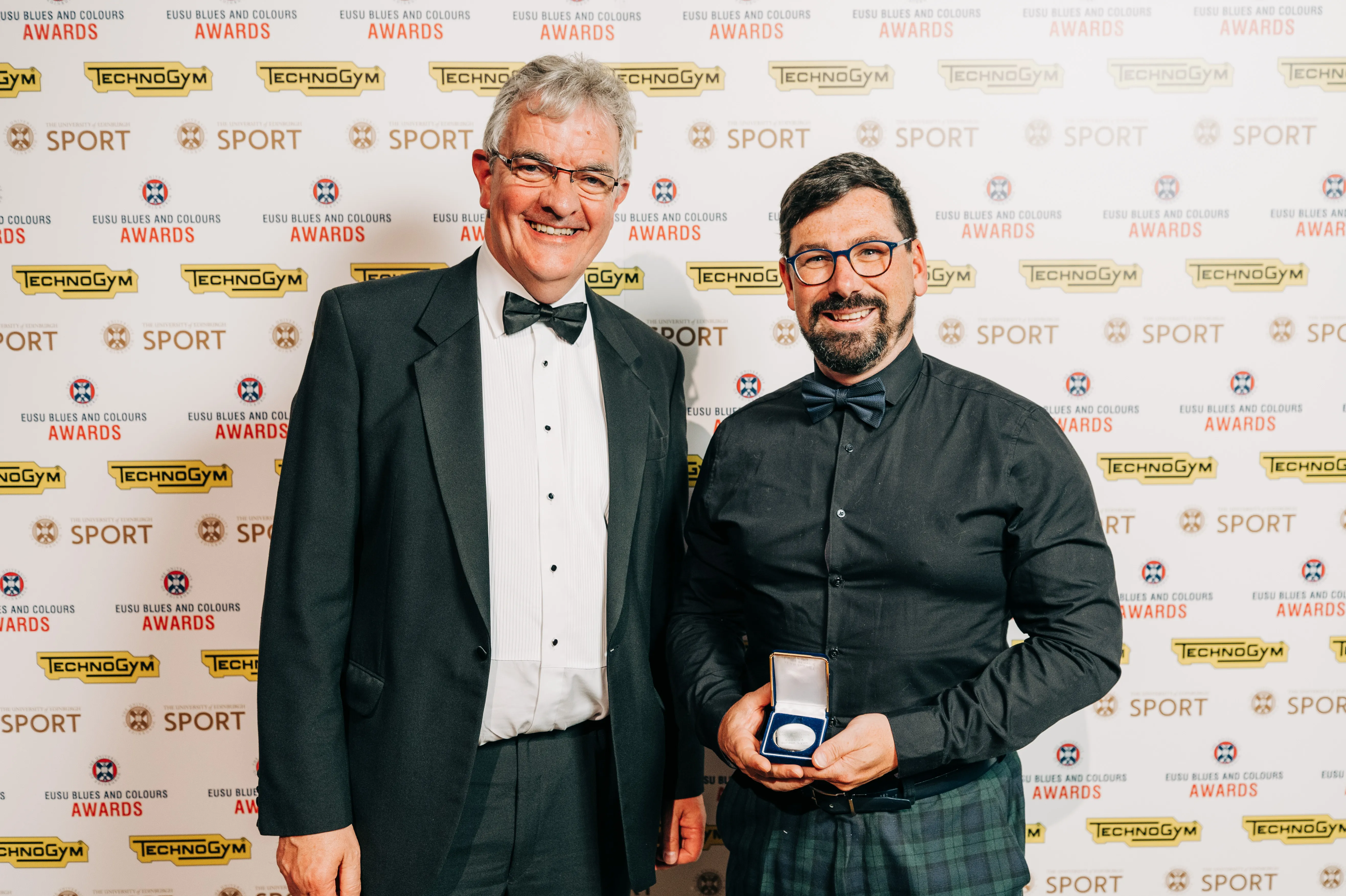 Gordon Lyon receiving the Alan Chainey award from Gary Jebb