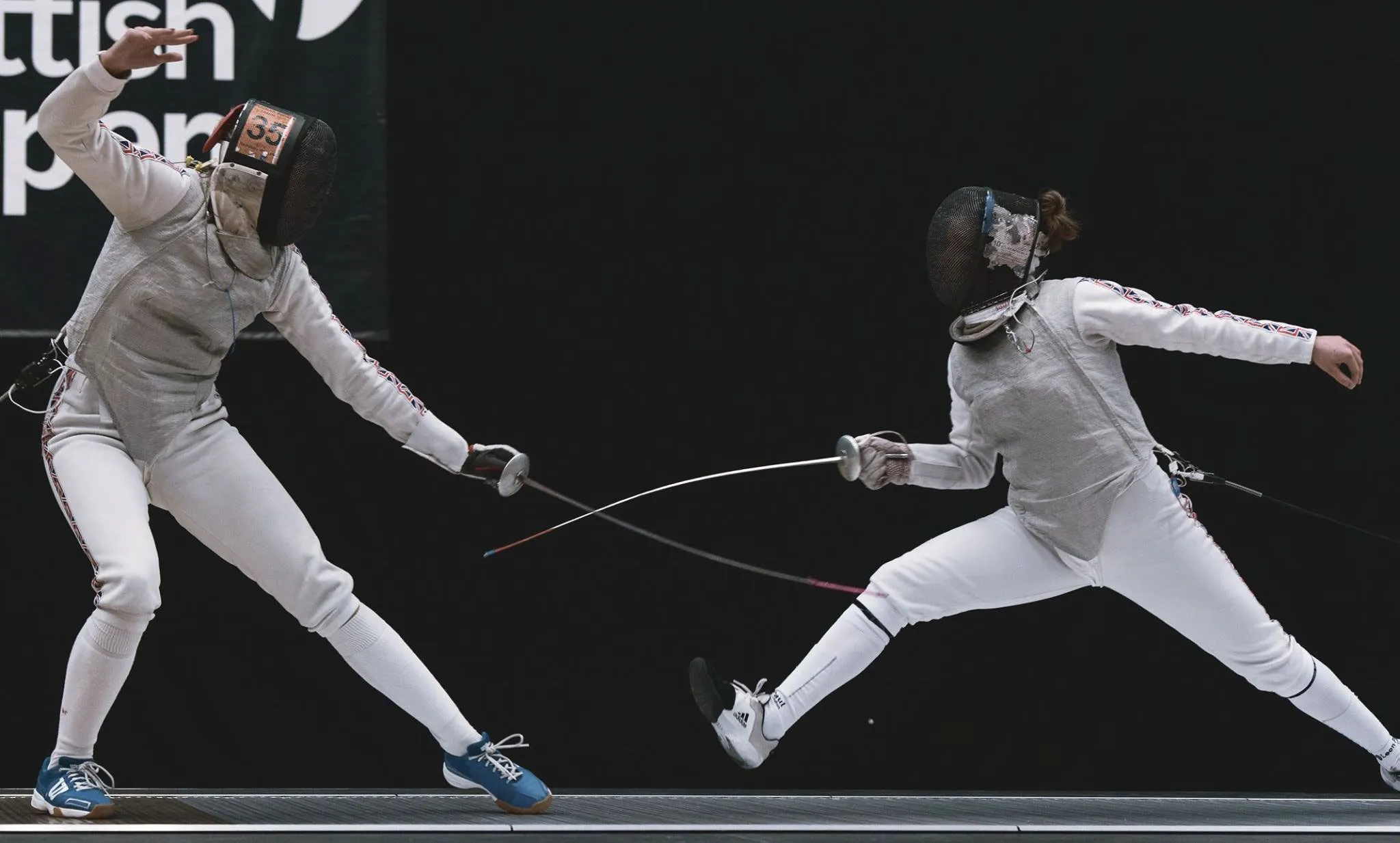 Two fencers in action