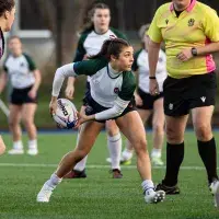 woman passing rugby ball in a match
