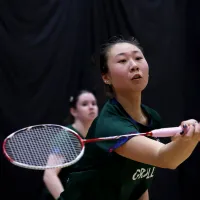 someone hitting a badminton shot