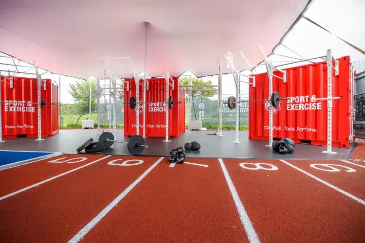 Outdoor gym with weights and track