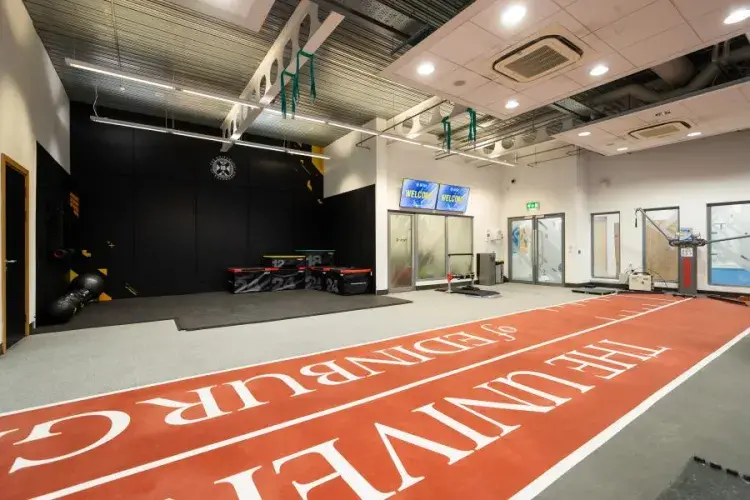 University logo on gym mats