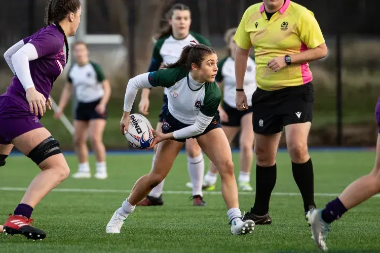 woman passing rugby ball in a match