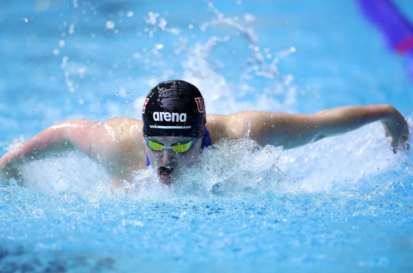 swimmer with black cap on