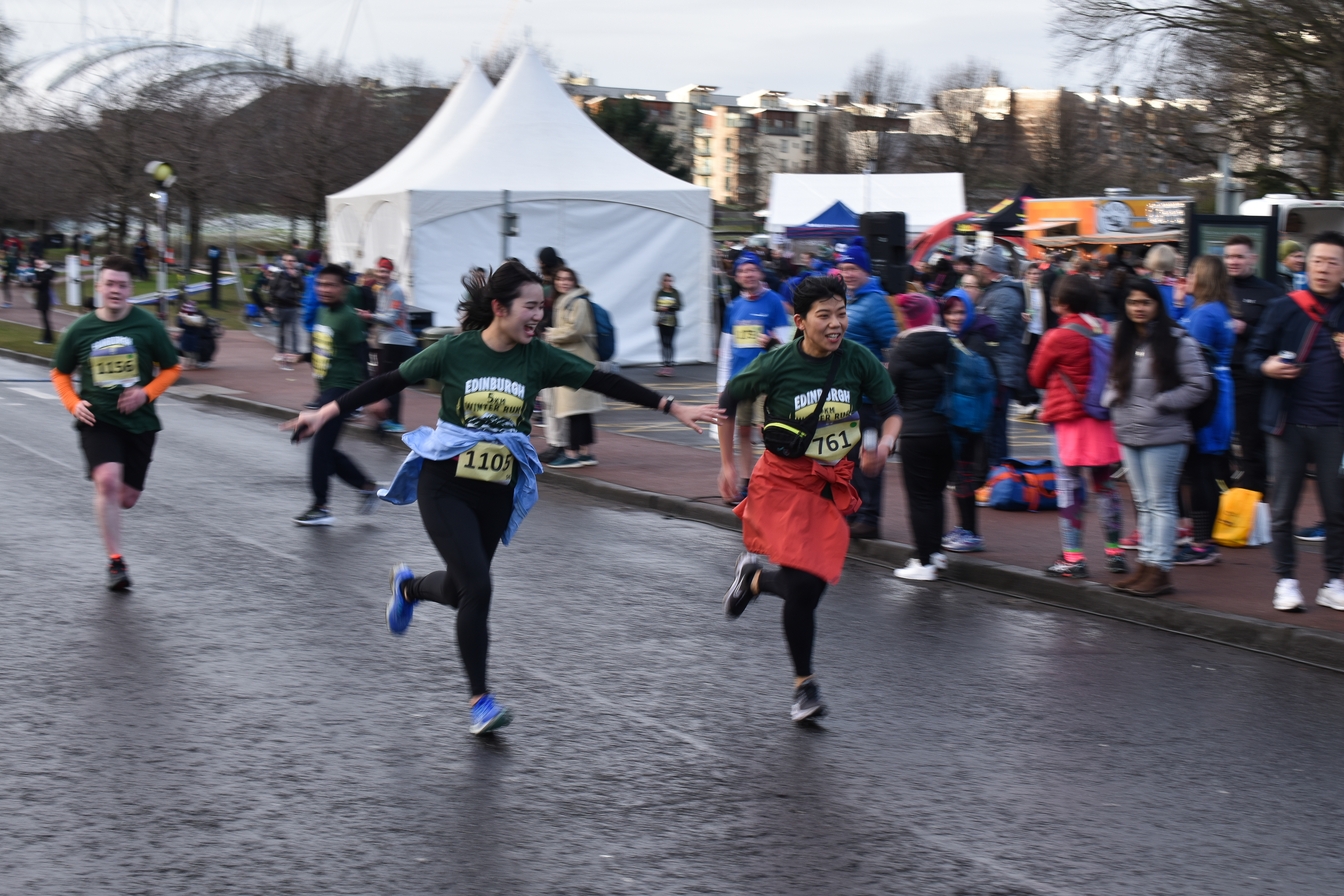 Runners celebrating at finishing line