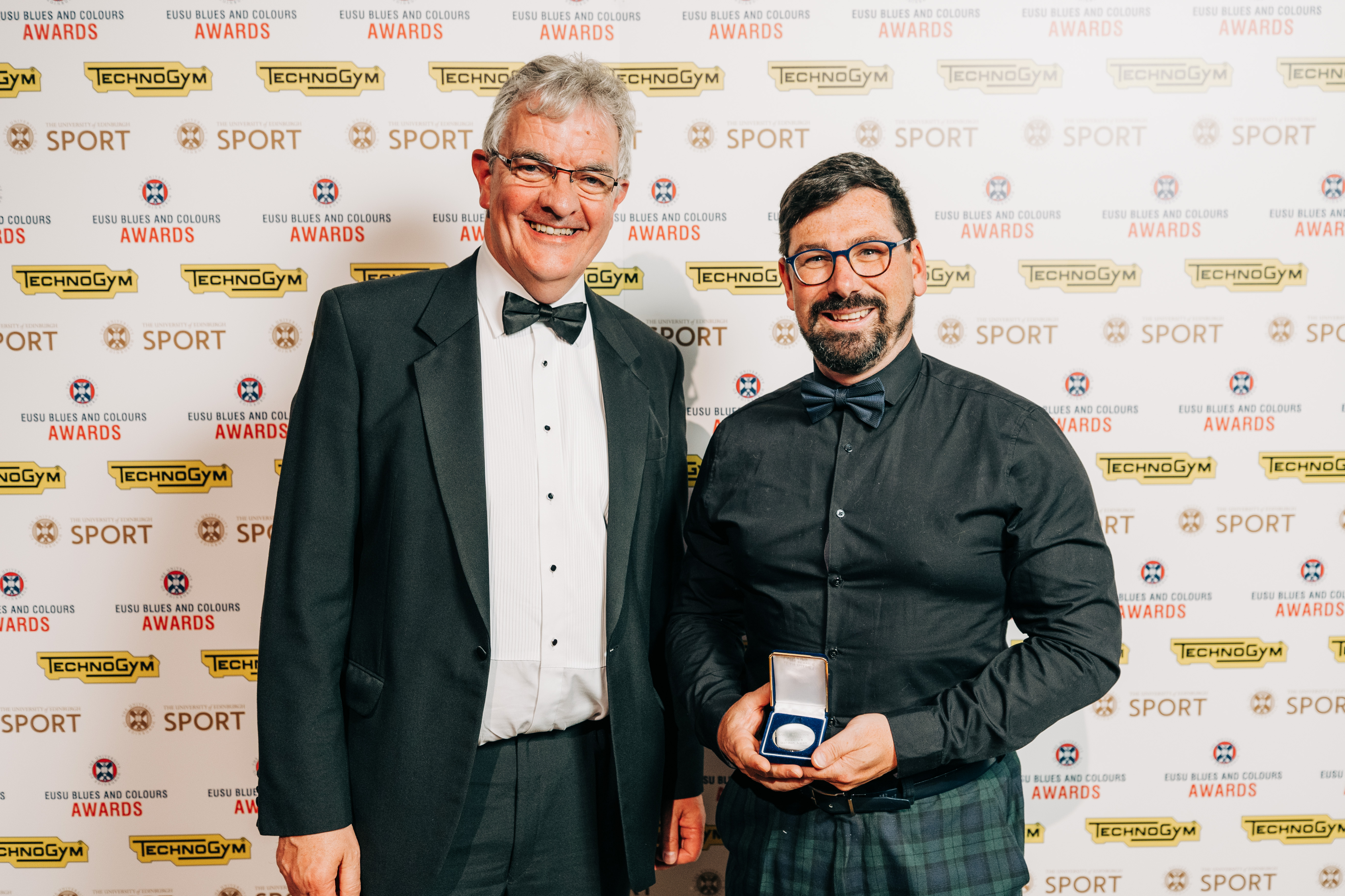 Gordon Lyon receiving the Alan Chainey award from Gary Jebb