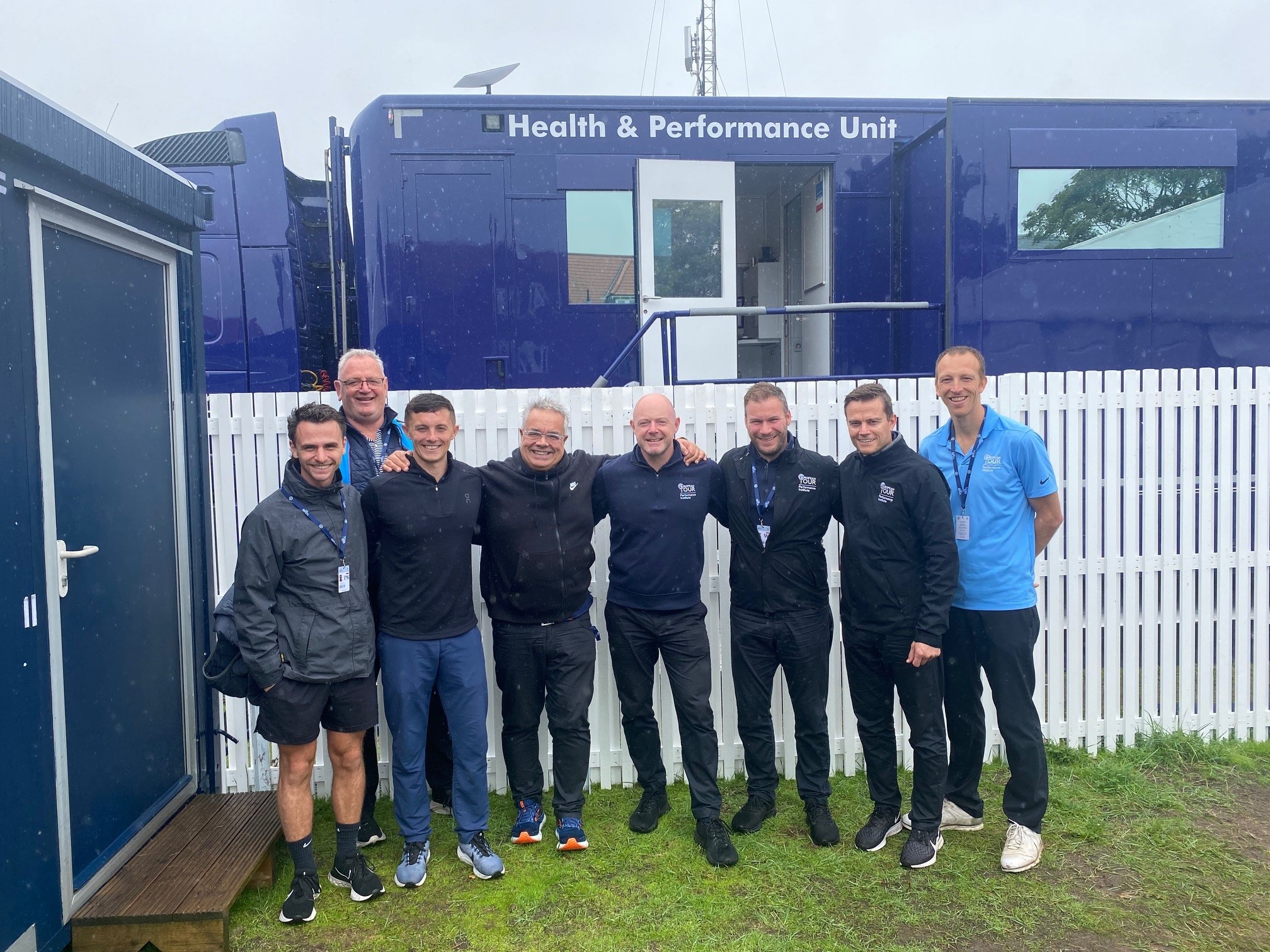 Image of players and medical team at the Open Championships including Peter Mitchell and Andrew Murray