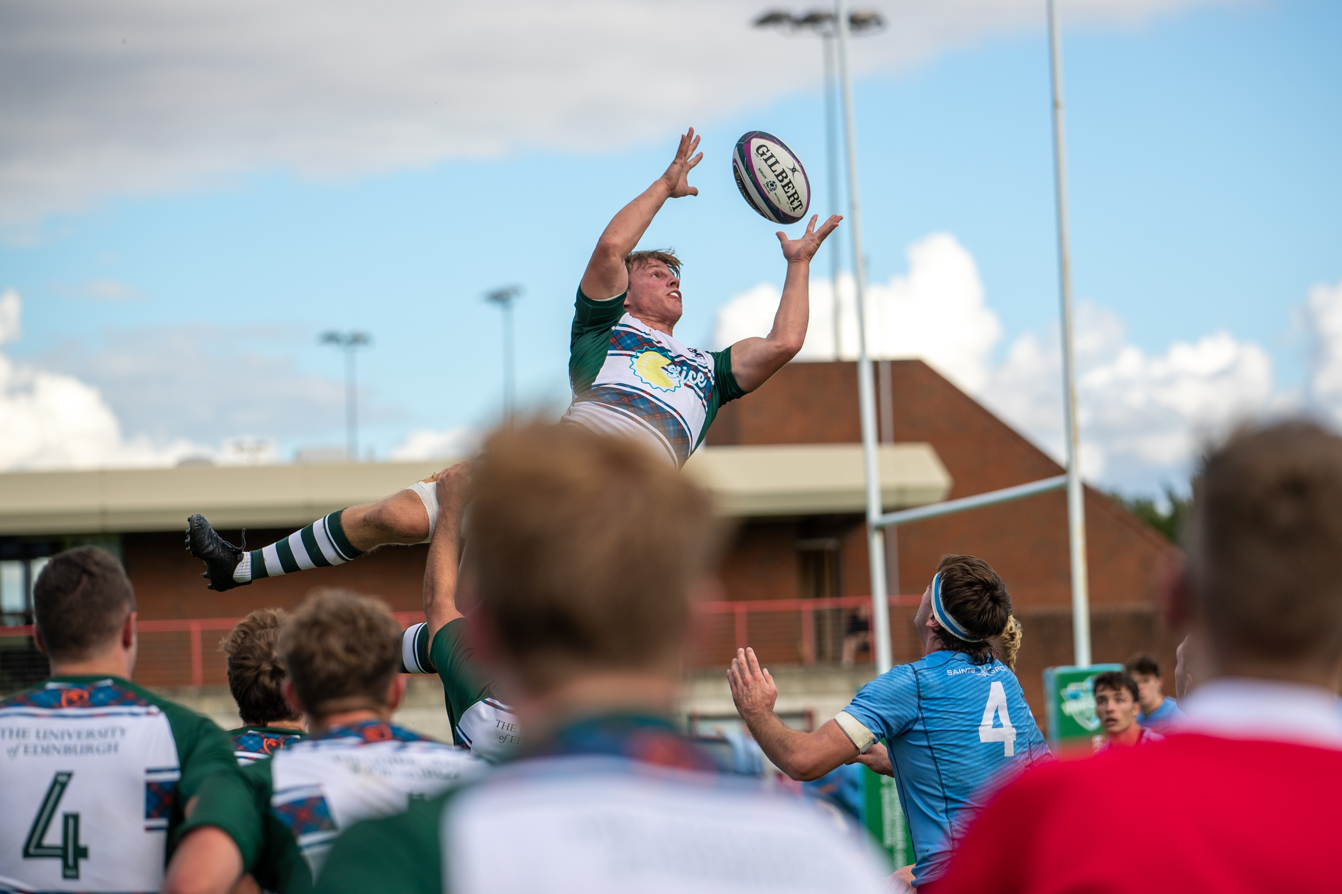 Men's rugby player catching ball from lineout