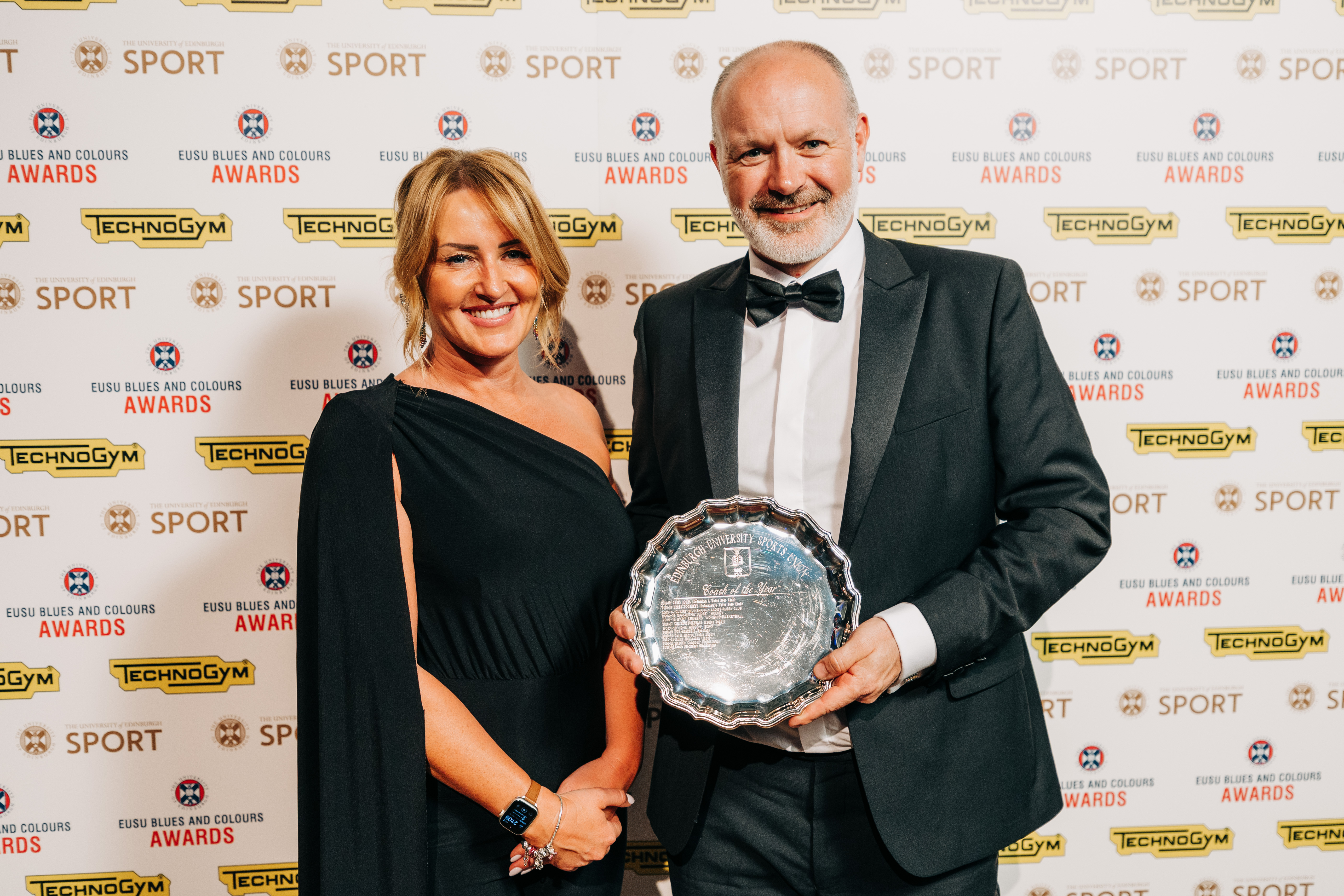 Bruce Flockhart receiving the Coach of the Year award from Kirsty Donaghy