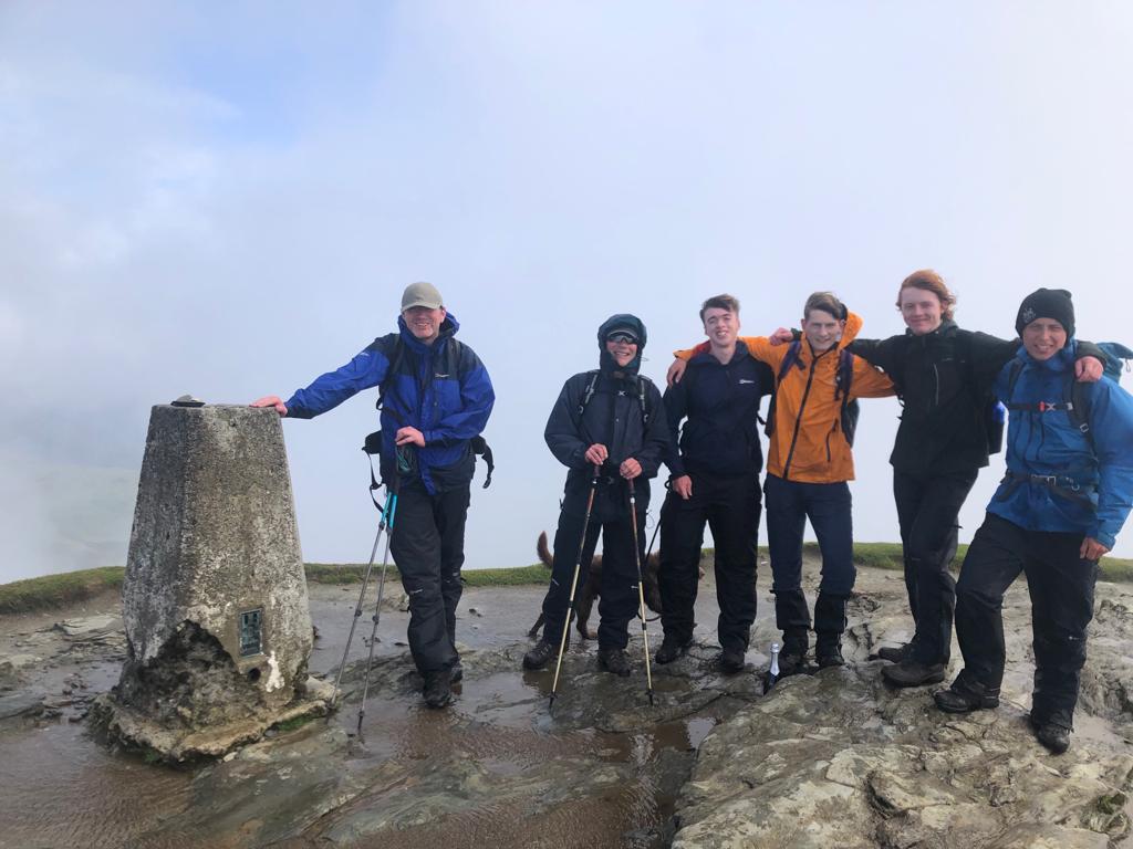 Group of walkers on the summit of Ben Lomond.