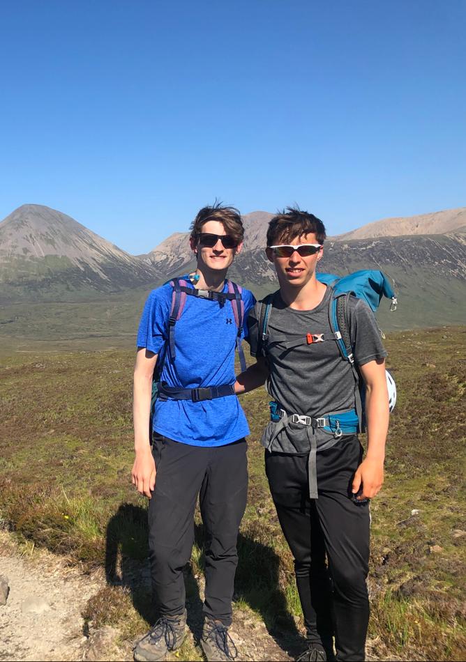 Two students walking out from the northern Cullins to Sligachan.