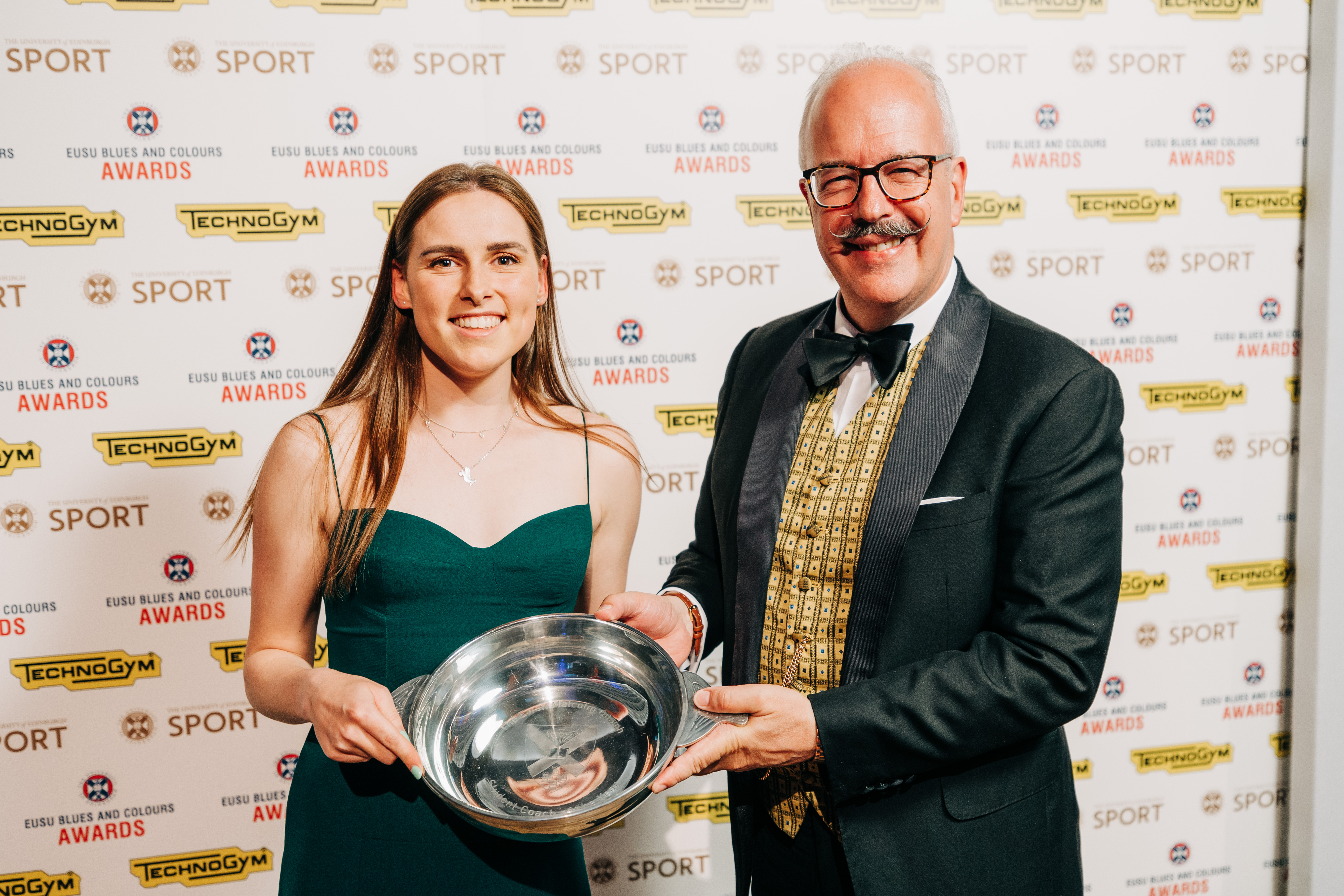 Hannah Campbell receiving the Student Coach of the Year award from Ewan Malcolm