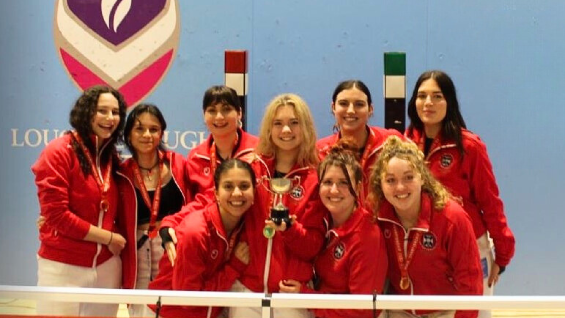 Image of Women's fencing team lifting Trophy at BUCS Big Wednesday