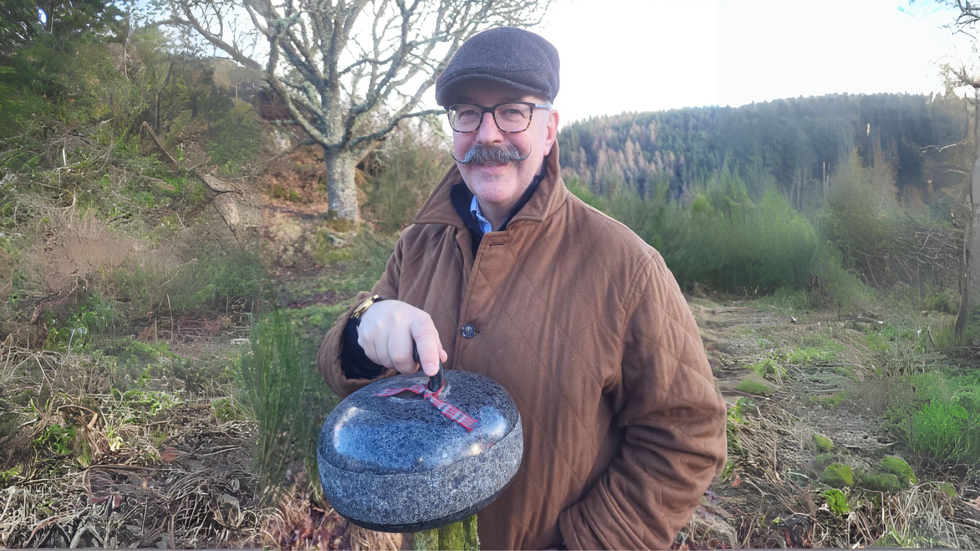 Ewan Malcolm holding curling stone